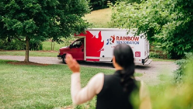 Rainbow Restoration technician shaking the hand of a customer.